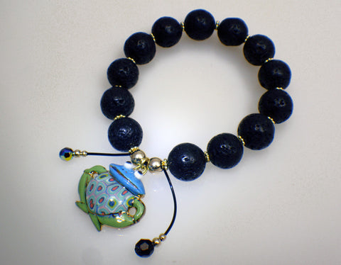 Lava stone bracelet with frog charm of porcelain 